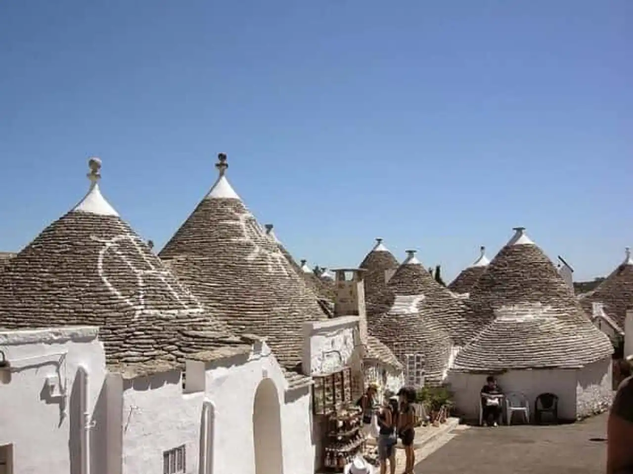 Alberobello trulli houses, houses, hens, Italy
